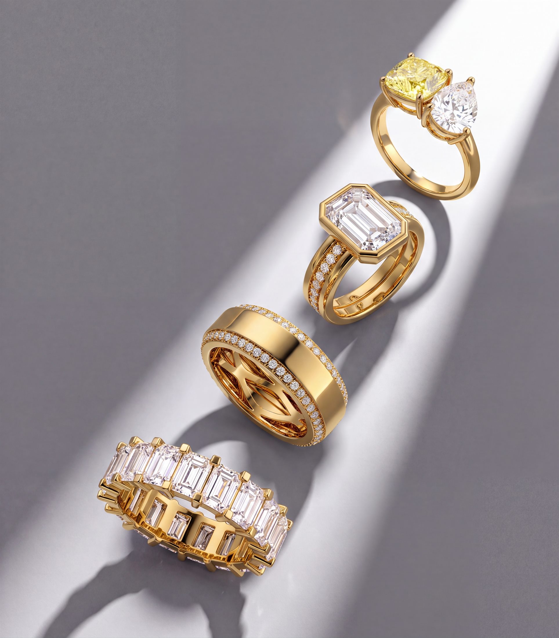 A collection of fine diamond rings arranged on a marble surface